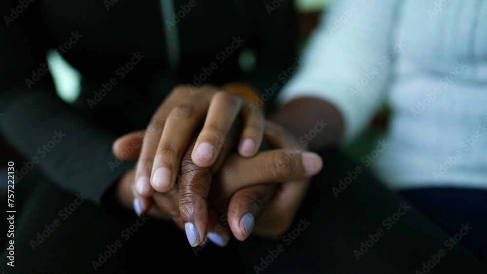 African American Granddaughter holding grandmother's hands and caring embrace showing love and support at family member in old age, teen girl kisses grandma's forehead