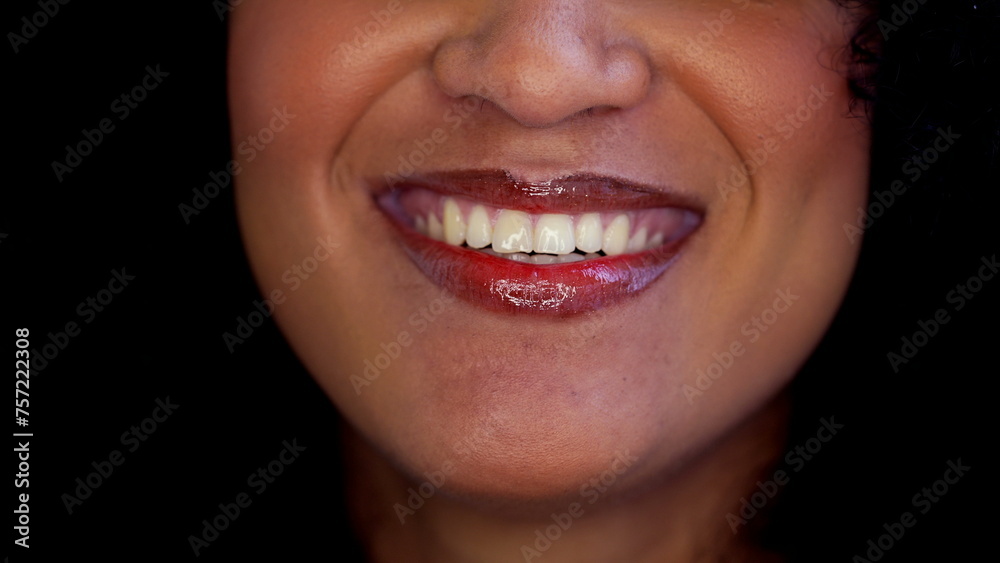 One happy black latina woman close-up mouth smiling in macro detail. Joyful emotion of South American adult girl of African descent wearing red lipstick One happy black latina woman close-up mouth smiling in macro detail. Joyful emotion of South American adult girl of African descent wearing red lipstick