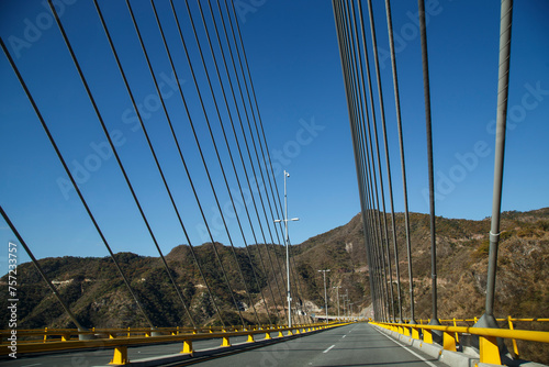 Puente Baluarte, el más alto del mundo, construcción atirantada de ingeniería moderna. De fondo la Sierra de Durango. Formaciones rocosas de la naturaleza, Orografía de Mexico. Semidesierto. photo