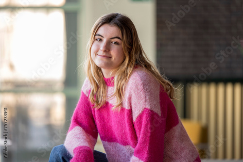 Casual day out, a young woman smiling offcamera. photo