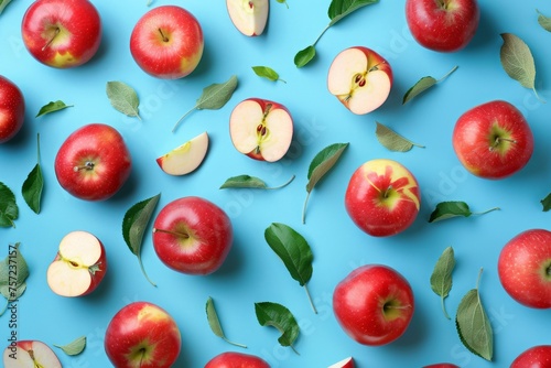 Colorful pattern of fresh ripe whole and sliced red apples