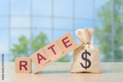 Interest Rate Concept with Wooden Blocks and money bag with dollar sign