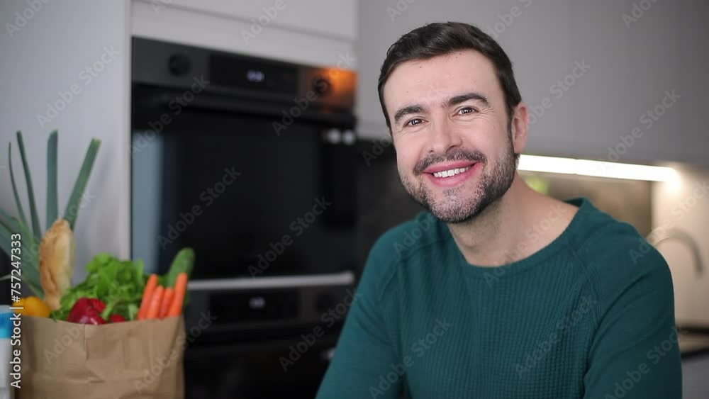 Man smiling in his cozy apartment Man smiling in his cozy apartment
