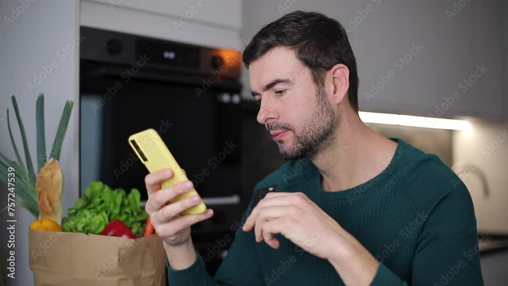 Man shopping online with credit card Man shopping online with credit card