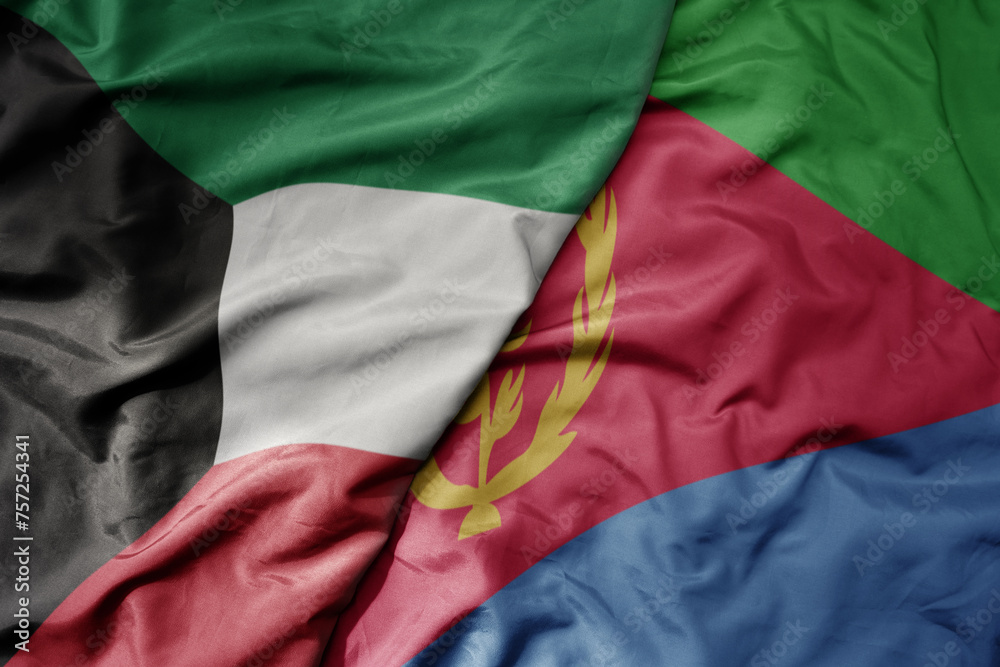 big waving national colorful flag of eritrea and national flag of kuwait.