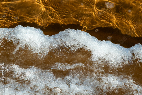 Ice Formation on Water Surface Capturing Winter Beauty
