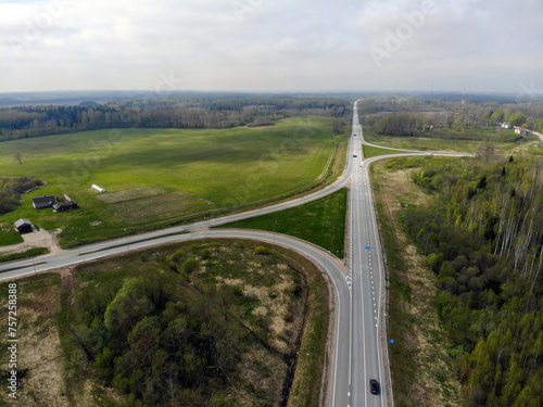 Aerial view of highway in the forest. View from above.