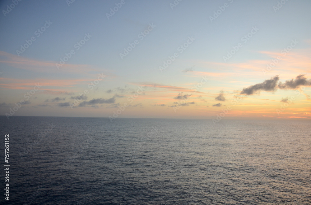 Soft sunset at calm sea, some clouds in the sky, concept for traveling, cruise traveling, planet earth