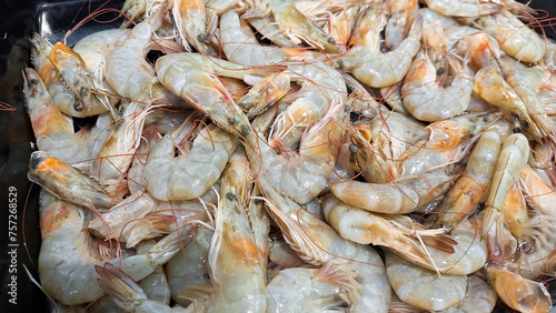 Fresh raw shrimp or prawn for selling in a plate in a fish market in Banjar City, Indonesia.