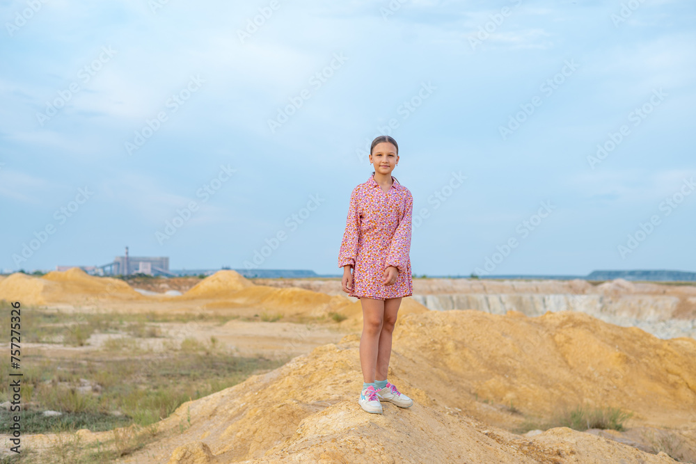 Schoolgirl walks in mountains around the city, child free time. Schoolgirl walks in mountains around the city, child free time.