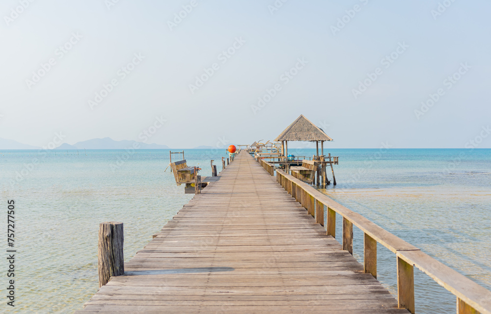 View of the wooden bridge extending into the sea of Koh Mak, Thailand.