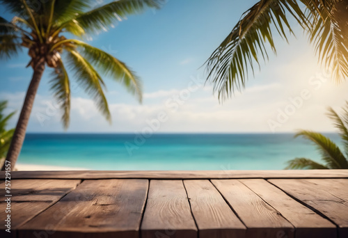 Top of wood table with seascape and palm tree, blur bokeh light of calm sea and sky at tropical beach background © Giuseppe Cammino