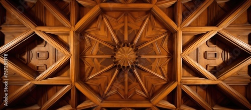 A closeup of a brown wooden ceiling with a symmetrical pattern of tints and shades  resembling artwork. The pattern consists of circles and rims  with a touch of metal detailing