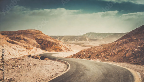 Asphalt highway in the desert. Adventure concept with vintage effect. Copy space for your text photo