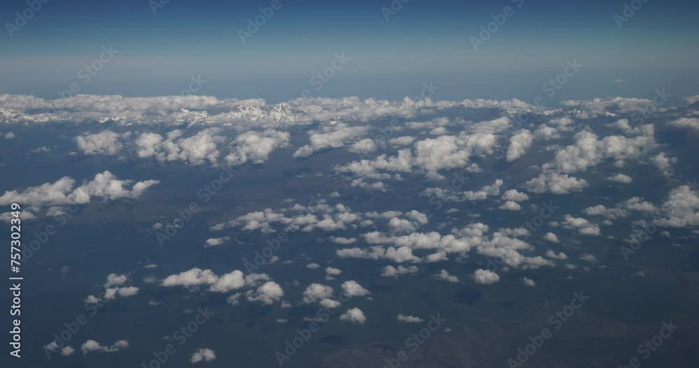 View From Airplane Window On Snow-capped Peaks Of Mount Elbrus And Main Caucasian Range. Aerial View From Airplane. Travel And Tourism Around World. Elbrus Is Highest Mountain In Europe. View From Airplane Window On Snow-capped Peaks Of Mount Elbrus And Main Caucasian Range. Aerial View From Airplane. Travel And Tourism Around World. Elbrus Is Highest Mountain In Europe.
