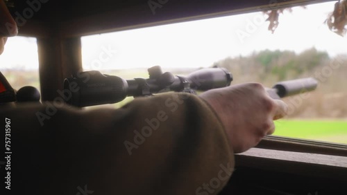 Wallpaper Mural hunter loading bullet into hunting rifle and aiming close up Torontodigital.ca