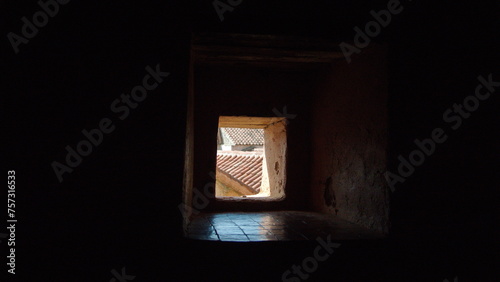 View out a window in a thick, stone wall in the Kasbah, in the Uta Hammam Square, in Chefchaouen, Morocco © Angela