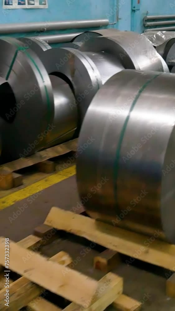 Stamping of sheet steel parts on a hydraulic press. Stamping on the press. Rolls of sheet steel for press forming of products in the factory. Steel sheet in coils. Stamping of sheet steel parts on a hydraulic press. Stamping on the press. Rolls of sheet steel for press forming of products in the factory. Steel sheet in coils.
