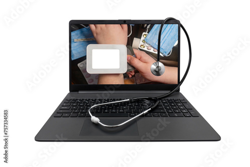 Laptop and medical stethoscope on a transparent background. On the laptop screen - a tonometer with a blank white screen on the hand against the background of a table with medicines photo