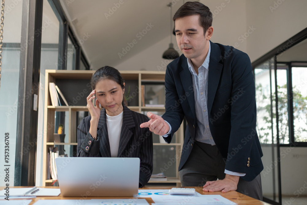 Mature executive helping new employee, Mentor, manager and teamwork with a business man training a female employee