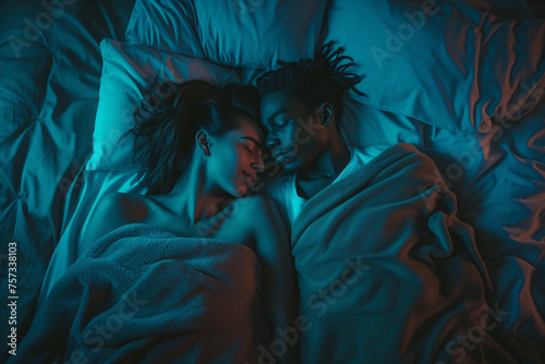 top view couple sleeping in bed at night. husband and wife cuddling, sleep hygiene concept good night rest and wellness