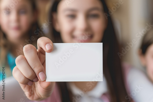 girl holding blank business card