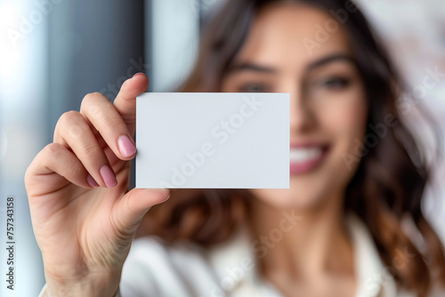 woman holding blank business card