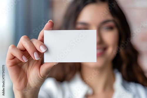 brown haired woman holding blank card