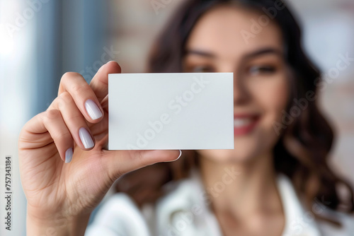 business woman holding blank card