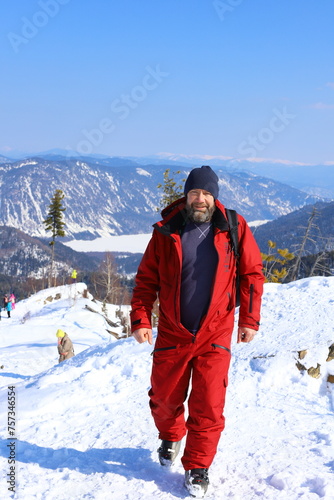 MOUNT KOKUYA, ALTAI, RUSSIA -  09 MARCH 2024: Mount Kokuya is an ideal location for winter sports. 
Views of the ski resort Teletski. Ski resort is located near Lake Teletskoye.  photo