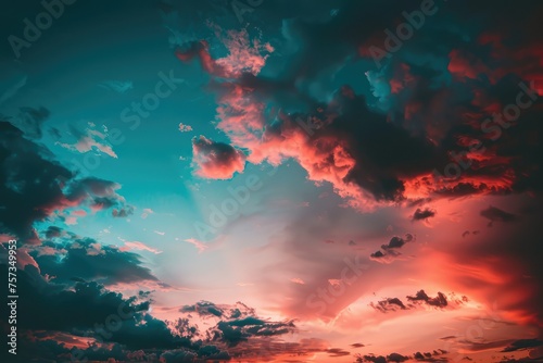 Dramatic sunset sky with vibrant colors, scattered clouds, and last rays of sunlight. A tranquil and awe-inspiring nature background capturing the beauty of the sky