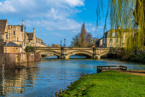 A view down the Riverside Park beside the River Welland towards Stamford Bridge in Stamford, Lincolnshire, UK in springtime photo