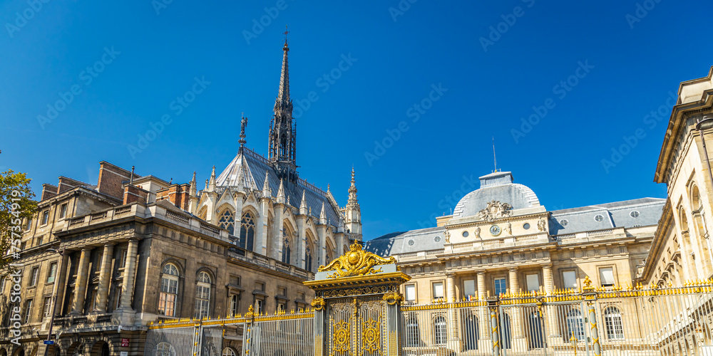 Exterior view of Paris courthouse and Sainte-Chapelle church on sunny day