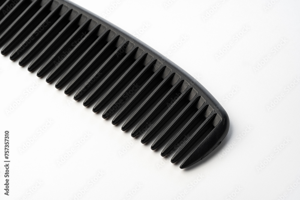 Black plastic hair comb isolated on white background Black plastic hair comb isolated on white background