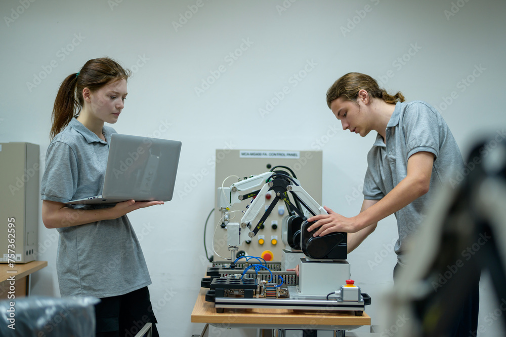 Trainee Robotics engineer learning with Programming and Manipulating Robot Hand Trainee Robotics engineer learning with Programming and Manipulating Robot Hand
