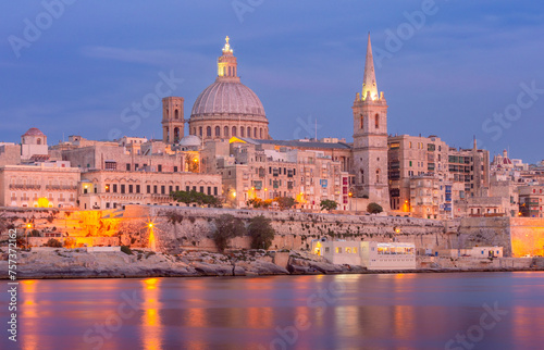 St John's Cathedral on the Valletta waterfront at sunset. © pillerss