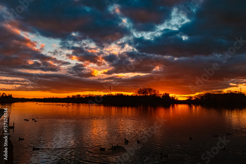 Summer sunset with reflections near Plattling, Isar, Bavaria, Germany