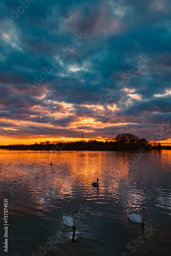 Summer sunset with reflections near Plattling, Isar, Bavaria, Germany