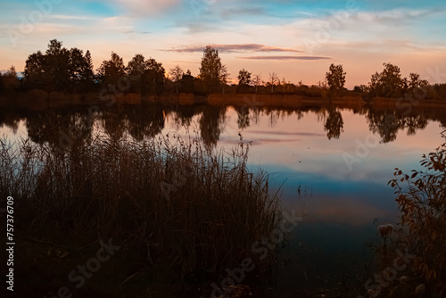Summer sunset with reflections near Aholming, Deggendorf, Bavaria, Germany