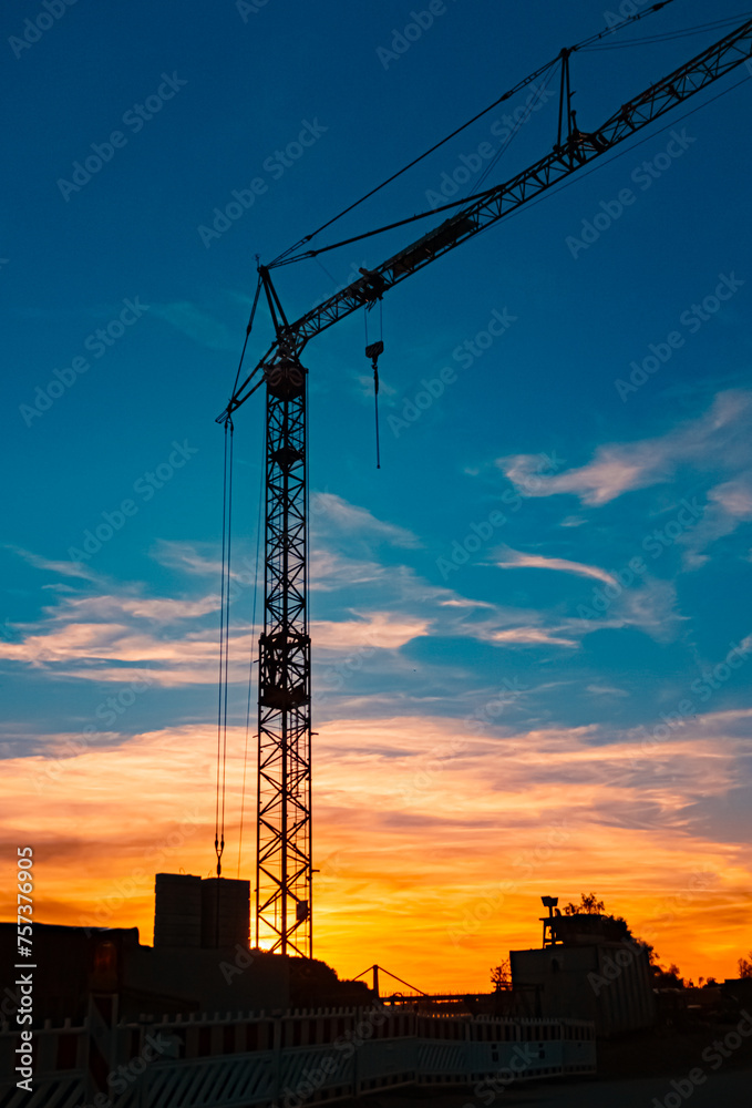 Summer sunset with a construction crane silhouette near Metten, Danube, Deggendorf, Bavaria, Germany