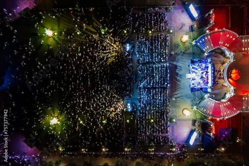 People at night open air concert aerial view