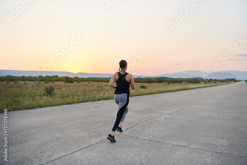 Solo Stride: Determined Athlete Woman Embarks on Fitness Journey for Marathon Preparation.