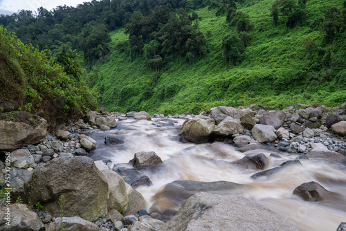 Gletscherfluss in tropischer Rwenzori Landschaft am Zusammenfluss von Bujuku und Mubuku River photo