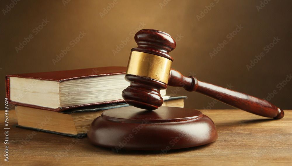 Wooden gavel and books on wooden table, law concept Wooden gavel and books on wooden table, law concept