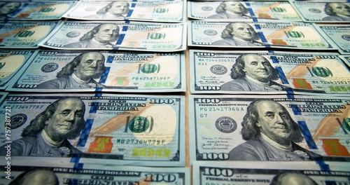 Lined up American dollar bills. The camera pans over the money. Business and finance. Crimes in the financial sector. Turnover of cash. Dirty money. sponsorship of terrorism.