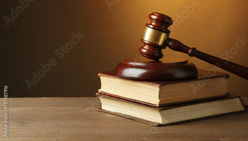 Wooden gavel and books on wooden table, law concept