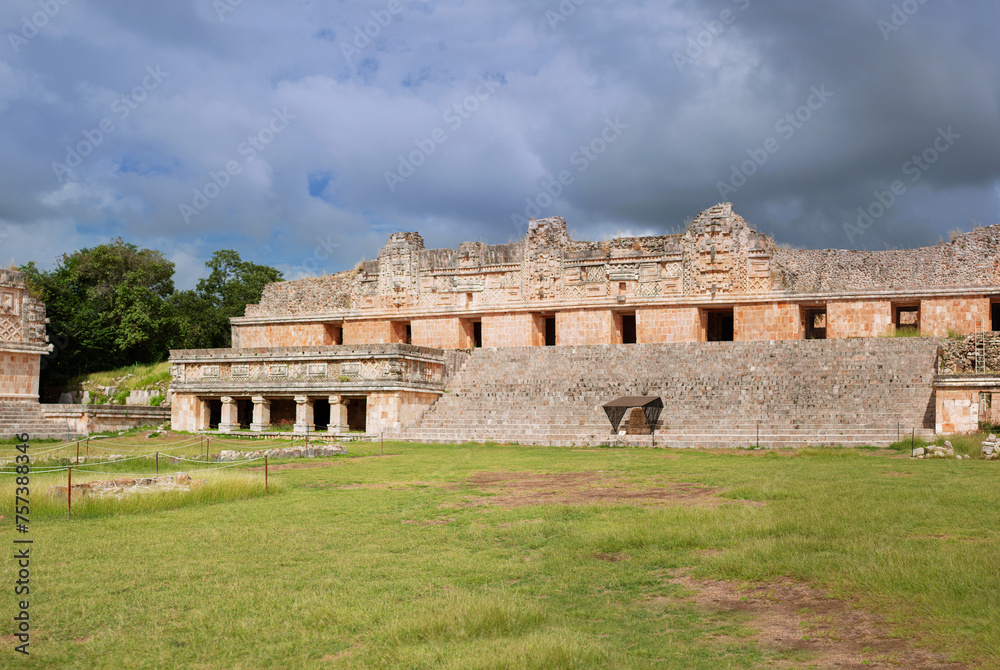 temple Quadrangle of the Nuns with remains of the carvings behind the Gran piramid in the ancient city Uxmal lost in the tropical jungle