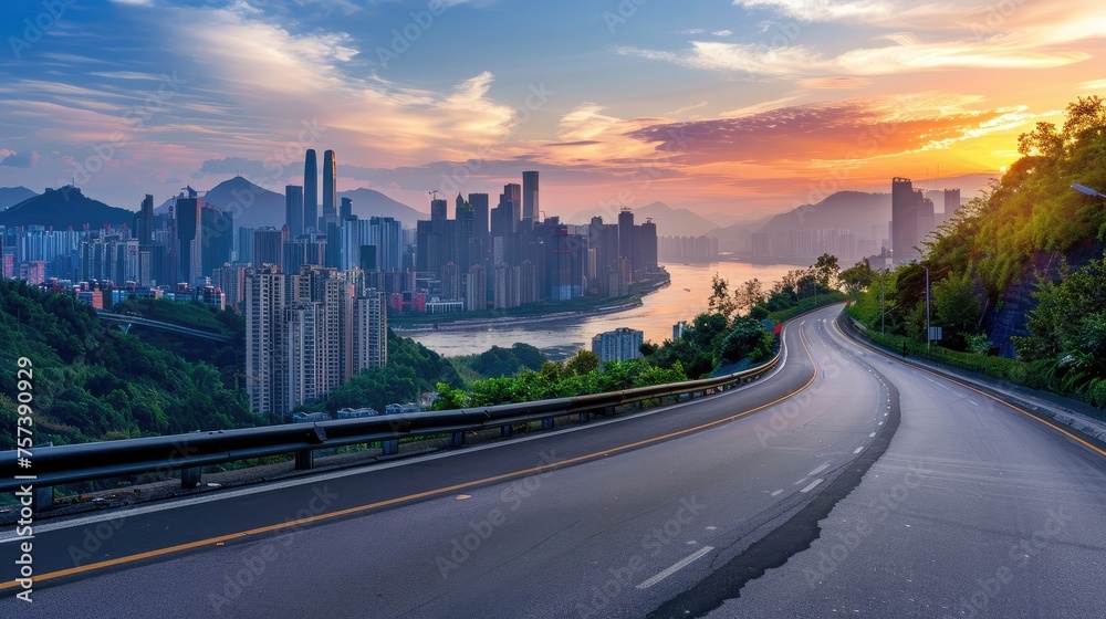 Asphalt highway road and mountains with city skyline at sunset