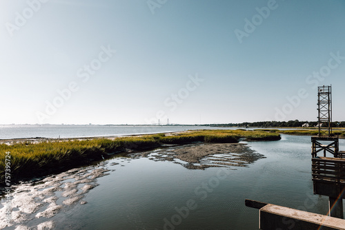 Pitt Street Beach Park in Mount Pleasant, South Carolina with a view across the water to the bridge to Charleston