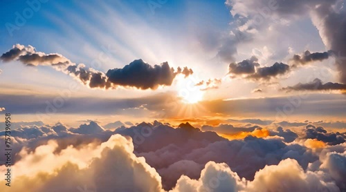 Cloudscape timelapse of sunset sky clouds with nice blue and yellow colors and sunlight through clouds Beautiful clouds in the sky with sunbeam at sunset photo